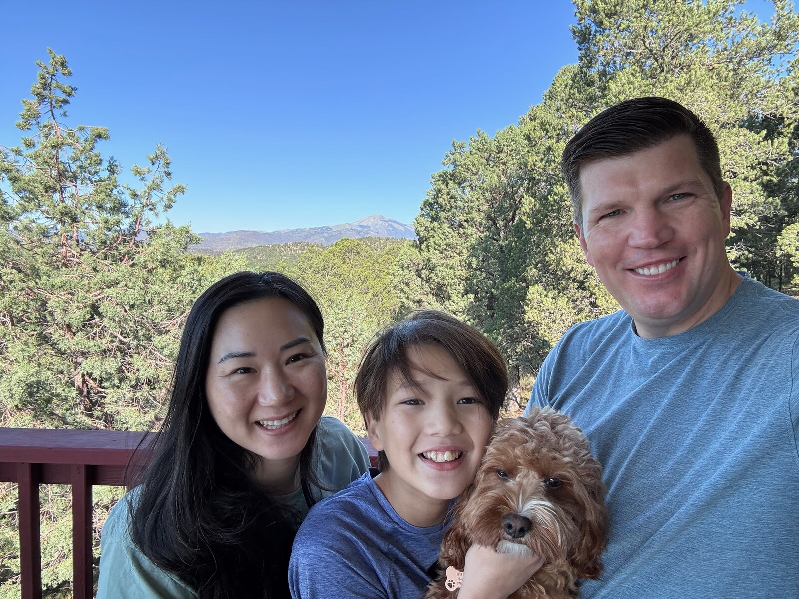 Ryan, Molly, Owen, and Harold taking a family selfie on the porch