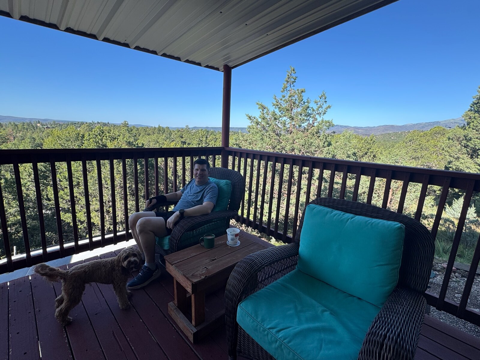 The red wraparound porch at Rain Dance Retreat overlooking the mountains